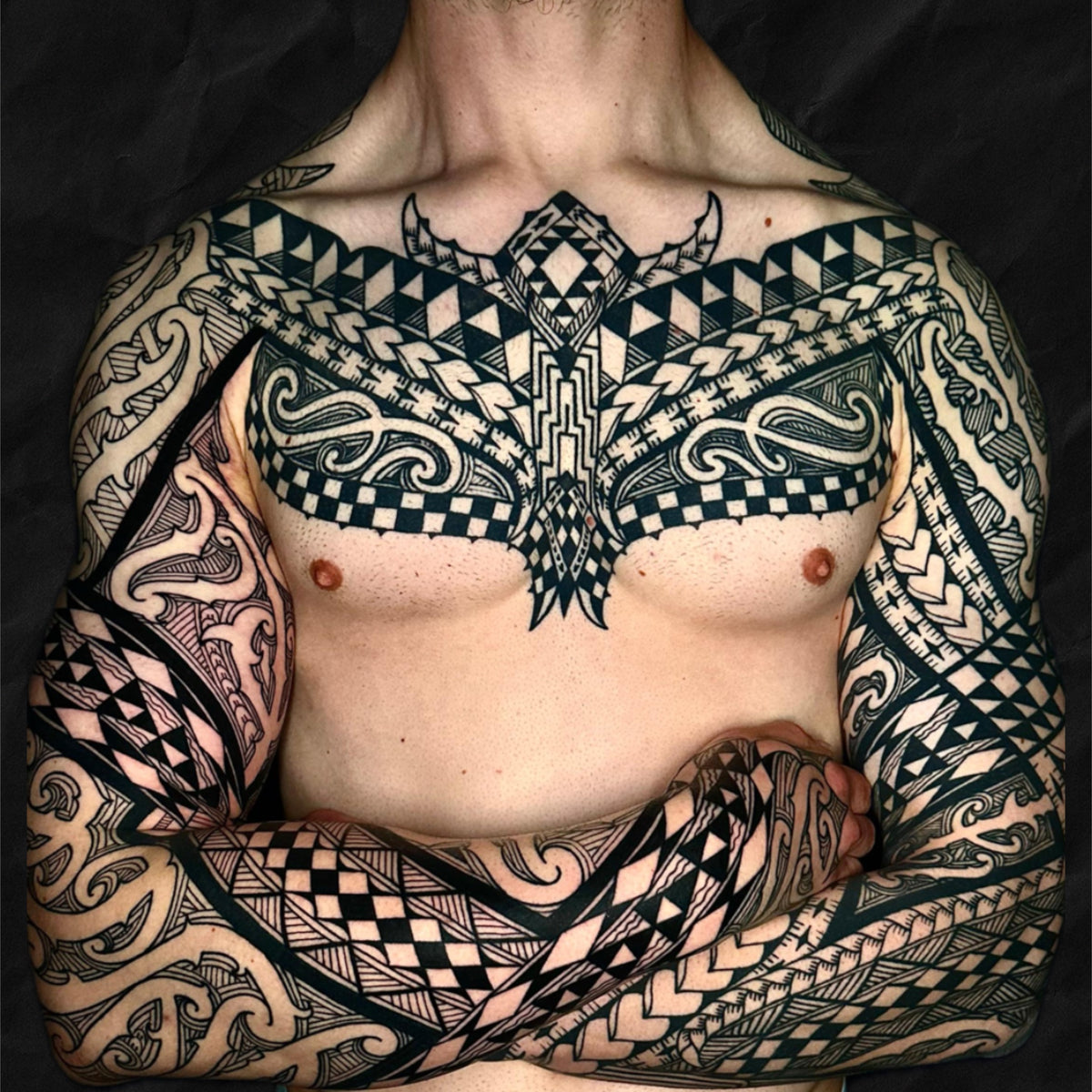 Maori Chest and Arm Tattoo